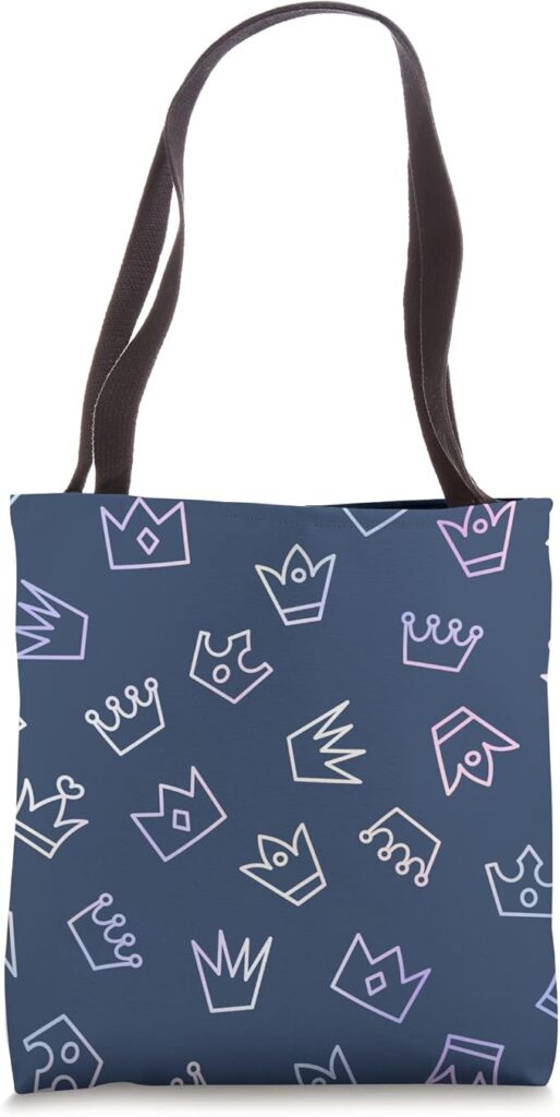 A stylish navy blue tote bag featuring a modern crown pattern with pastel accents. A trendy and reusable bag perfect for shopping, work, and everyday fashion.